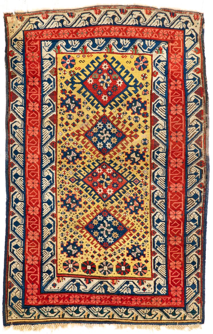 A RARE CAUCASIAN YELLOW GROUND KUBA RUG, MID 19TH CENTURY