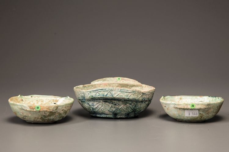 Three green glazed pottery ear cups