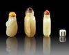 THREE CHINESE CELADON JADE SNUFF BOTTLES