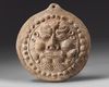 A SELJUK FIGURAL TERRACOTTA TILE ANTEFIX, 12TH CENTURY