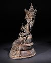A SINO-TIBETAN BRONZE FIGURE OF THREE-HEADED SEATED BODHISATTVA