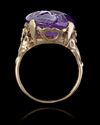 A ROMAN INTAGLIO IN AMETHYST WITH A FOOT OF MERCURY AND BUTTERFLY MOUNTED IN A 19TH CENTURY RING, INTAGLIO 1ST CENTURY BC-AD