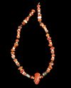A CARNELIAN BEAD NECKLACE WITH CARVED FROG SCARABOID PENDANT