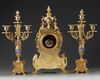 A FRENCH CHAMPLEVÉ ENAMEL CLOCK SET, 19TH CENTURY