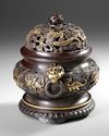 A CHINESE PARCEL-GILT BRONZE 'SEA CREATURES' CENSER, COVER AND STAND