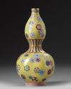 A CHINESE FLOWER ROUNDEL DOUBLE GOURD VASE
