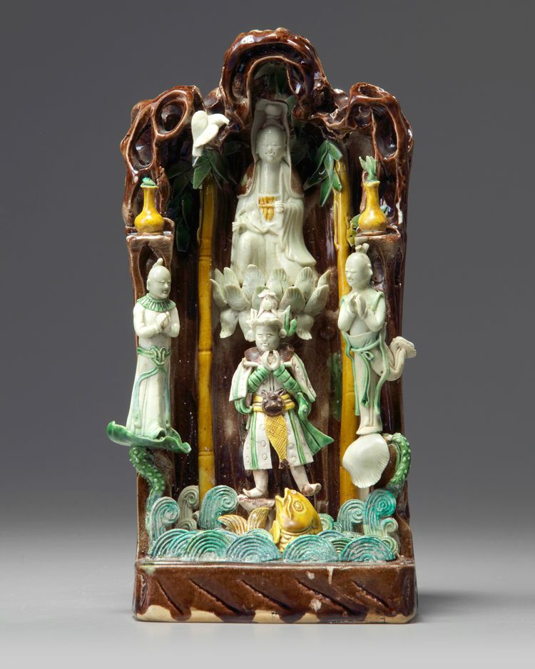 A Chinese green, yellow, and aubergine-glazed grotto