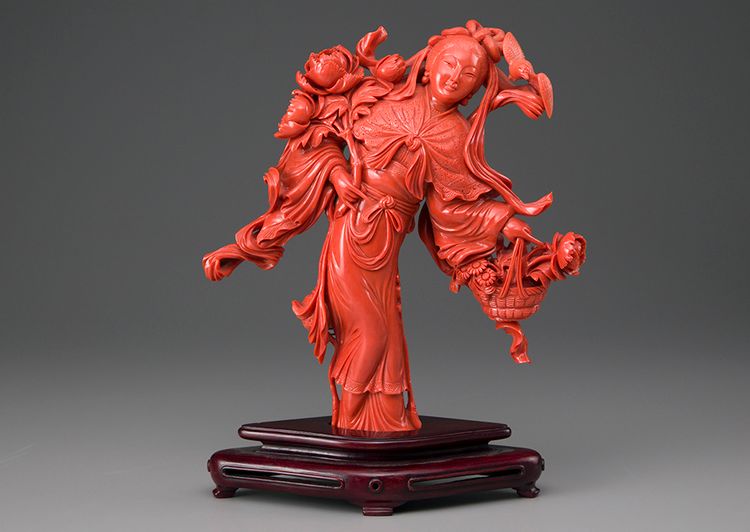 A large coral carving of a lady