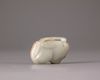 A Chinese celadon and russet jade carving of two peaches