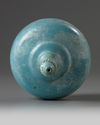 An Islamic turquoise glazed bottle vase