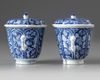 A pair of Chinese blue and white twin-handled chocolate cups and covers
