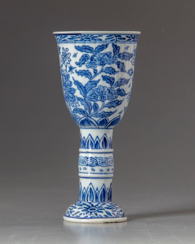 A Chinese blue and white stem beaker