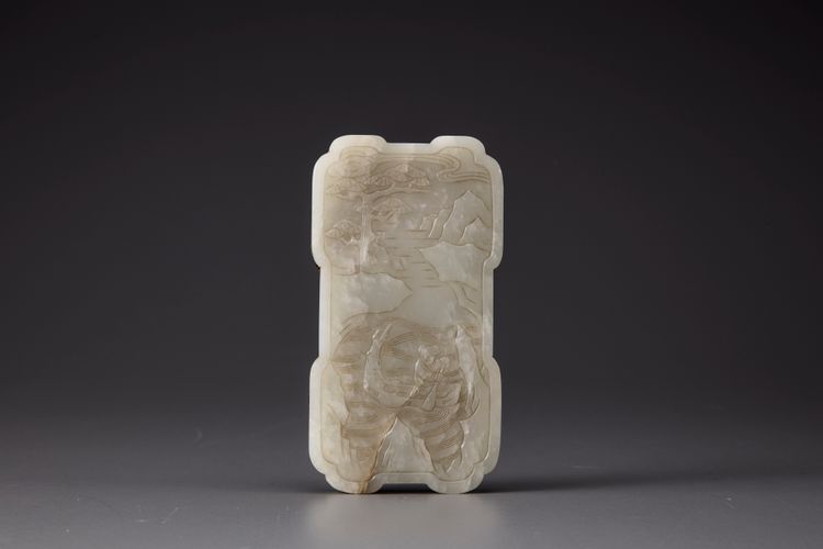 A white jade plaque mounted as a mirror