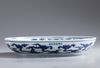 A large Chinese Ming-style blue and white 'dragon' charger