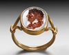 A RENAISSANCE CARNELIAN INTAGLIO PORTRAIT OF THE EMPEROR HADRIAN IN A MODERN GOLD RING, CIRCA 17TH CENTURY A.D.