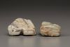 A creamy jade water buffalo and a celadon and russet jade Buddhist lion