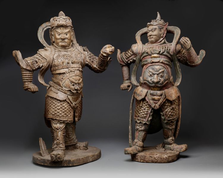 A matched pair of Chinese polychrome wood guardian figures