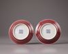 A pair of Chinese copper-red-glazed saucers