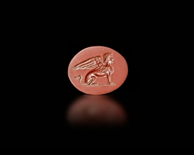 A ROMAN RED JASPER INTAGLIO, CYRENE AS SPHINX, 1ST-2ND CENTURY AD