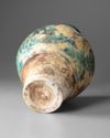 A RAQQA TURQUOISE AND BLACK GLAZED POTTERY VASE, SYRIA 12TH-13TH CENTURY
