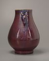 A Chinese flambé-glazed deer-handled vase. Hu