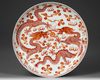 A CHINESE IRON-RED-DECORATED DRAGON DISH,  19TH-20TH CENTURY