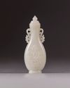 A small Chinese white jade flattened baluster vase and cover