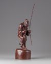 A Chinese hardwood carving of a fisherman