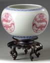 A pair of Chinese famille rose 'dragon' jardinieres