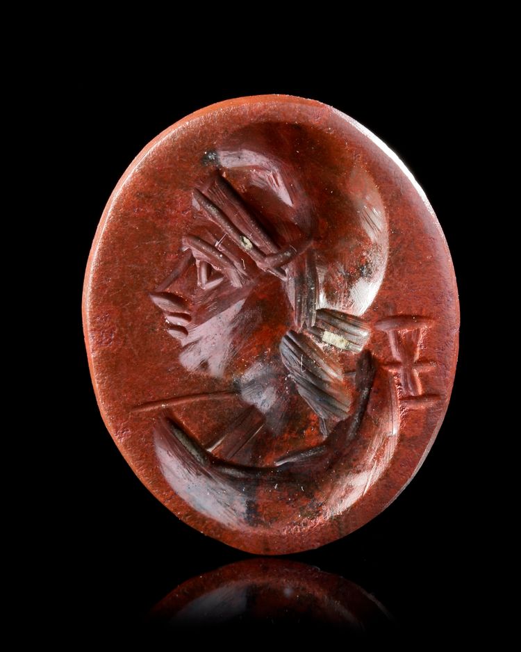 A ROMAN RED JASPER INTAGLIO WITH A BUST OF MEN, 1ST-2ND CENTURY AD