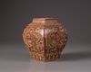 A  copper-red square-shaped vase