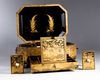 A Chinese gilt and black lacquered box and cover