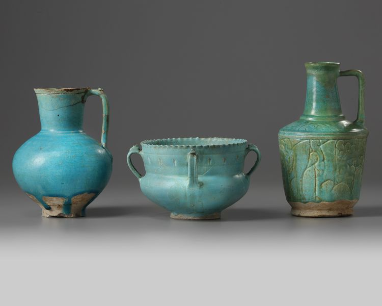 Two Islamic turquoise glazed jugs and a bowl