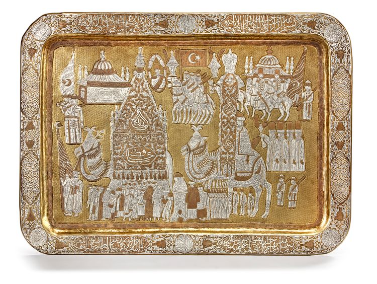 A LARGE MAMLUK REVIVAL SILVER AND COPPER INLAID BRASS TRAY DEPICTING THE MAHMAL PROCESSION TO MECCA, SYRIA, 19TH CENTURY
