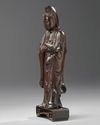 A Chinese hongmu carving of Guanyin and stand