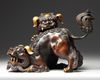 A PARCEL GILT CHINESE BUDDHIST LION FORM CENSER, 20TH CENTURY