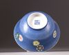 A Chinese blue-ground sgraffiato famille rose 'roundels' bowl