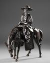 A CHINESE BRONZE FIGURE OF A SCHOLAR RIDING A DONKEY,19TH CENTURY