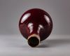 A red glazed bottle vase