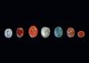 FOUR INTAGLIOS AND THREE CAMEOS IN VARIOUS MATERIALS, ANCIENT AND MODERN