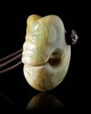 A CHINESE JADE PIG-DRAGON HOOK PENDANT, 20TH CENTURY