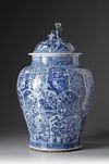 A large blue and white jar with cover