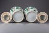 A pair of famille verte vases with cover