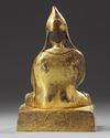 A Chinese gilt bronze figure of a Lama