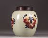 A Chinese celadon-ground 'nine peaches' ovoid jar