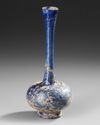 A COBALT-BLUE GLASS SPRINKLER FLASK, 9TH–11TH CENTURY