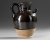 A CHINESE CIZHOU WARE BLACK-GLAZED EWER (PITCHER)