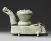 A CHINESE GREEN-GLAZED POTTERY STOVE WITH A DRAGON CHIMNEY