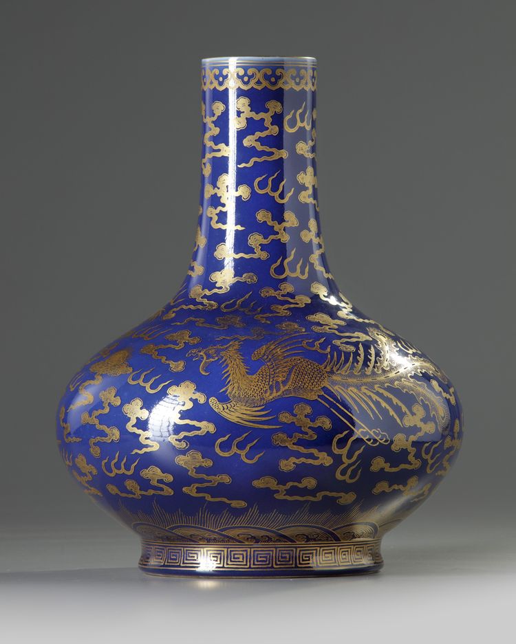 A Chinese blue-ground gilt-decorated 'dragon and phoenix' bottle vase