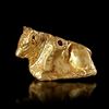 AN EAST GREEK GOLD REPOUSSE RECLINING BULL, 6TH/7TH CENTURY BC